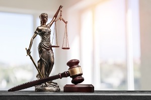 Gavel and statue, Nursing Home Abuse Lawyer in Bloomington IL