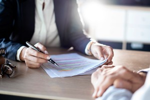A Social Security Attorney in Peoria IL speaking with a client