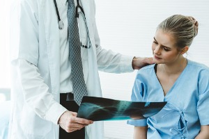 Doctor talking with woman patient in Pekin IL