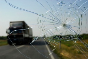 The cracked windshield of a car in an accident, where the driver needs a Truck Accident Lawyer in Pekin IL