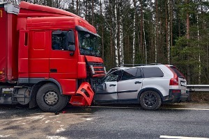 A semi-truck in a head-on collision with a car, where the owner will need a Truck Accidents Lawyer in Pekin IL