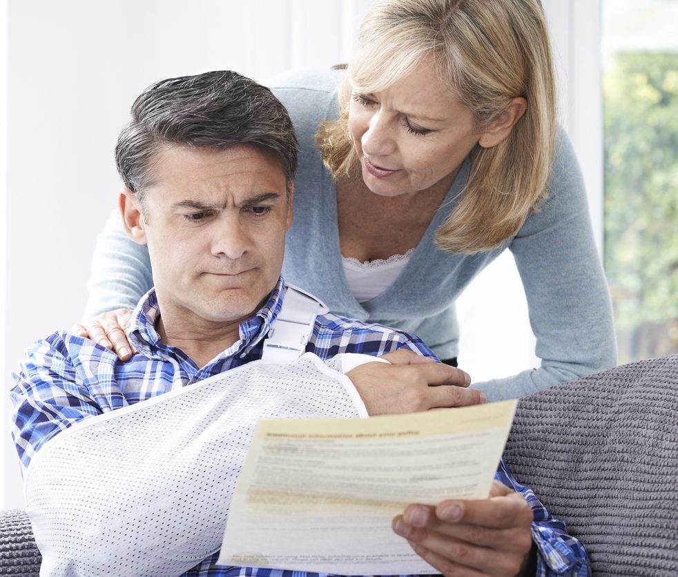 Couple Reading Letter About Husband's Injury